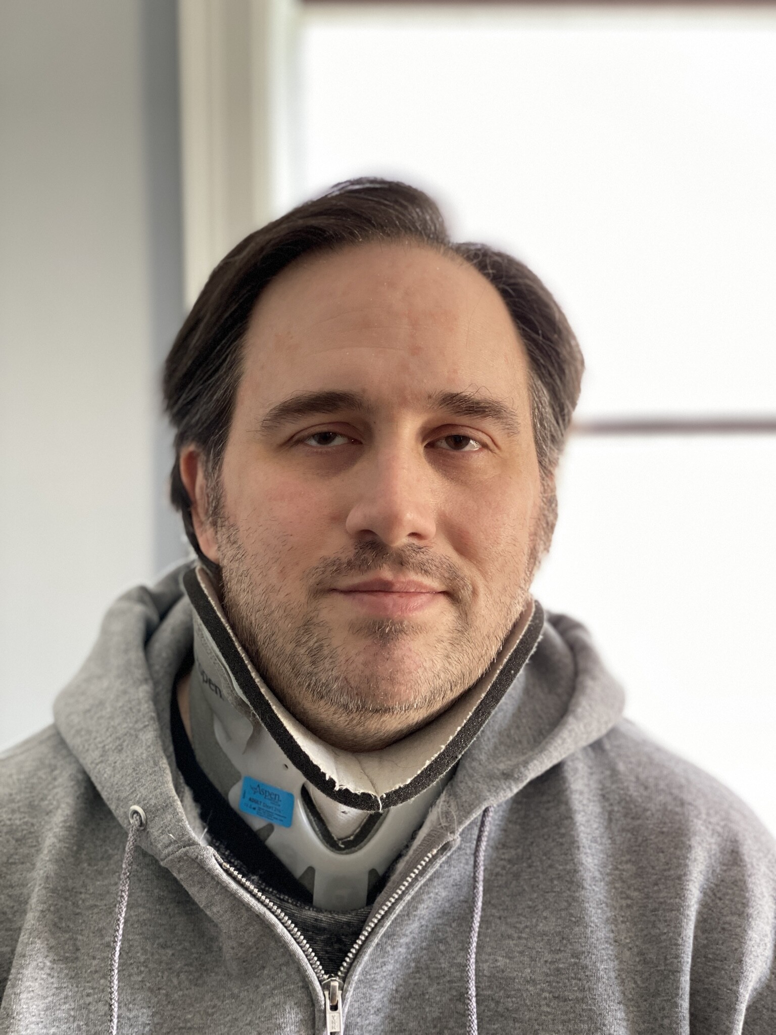 Author wearing cervical collar, full size